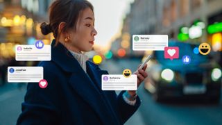 A woman reads social media messages on her smartphone, with notifications displayed near her in the air