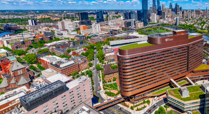 A bird's-eye view of Penn Medicine and the University of Pennsylvania campus with the city skyline in the background.