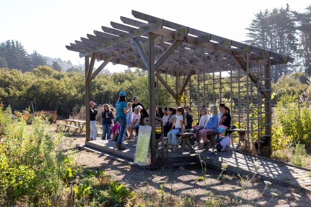 Sara Neale, HEAL Project farm educator, takes a group of third graders from El Granada Elementary School on a field trip Wednesday, Oct. 23, 2024, Half Moon Bay, Calif. (Karl Mondon/Bay Area News Group)