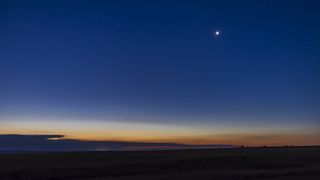 a photo of Venus glowing brightly in the night sky