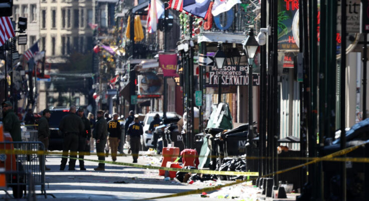 Members of the FBI and New Orleans Police are on the scene on Bourbon Street after at least 10 people were killed when someone drove into a crowd early on New Year's Day. (Chris Graythen/Getty Images)